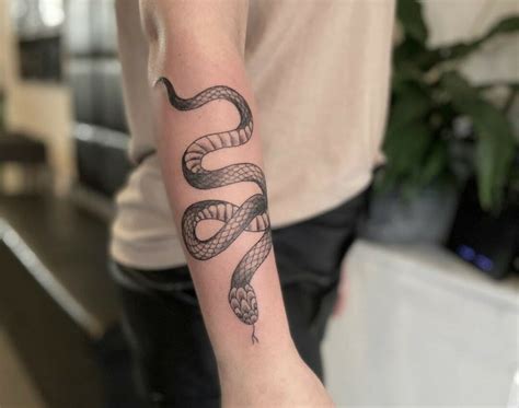 Tattoo snake forearm - Read this article to find out how to avoid and reduce the number of snakes in your yard or garden. Expert Advice On Improving Your Home Videos Latest View All Guides Latest View Al...